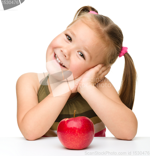Image of Little girl with red apple