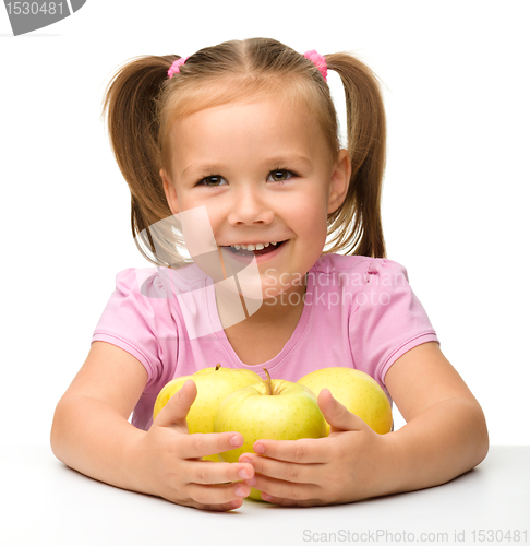 Image of Little girl with apples