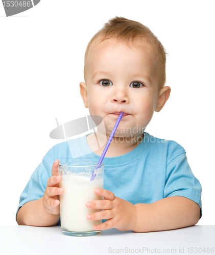 Image of Cute little boy is drinking milk