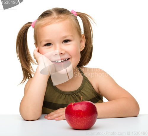 Image of Little girl with red apple