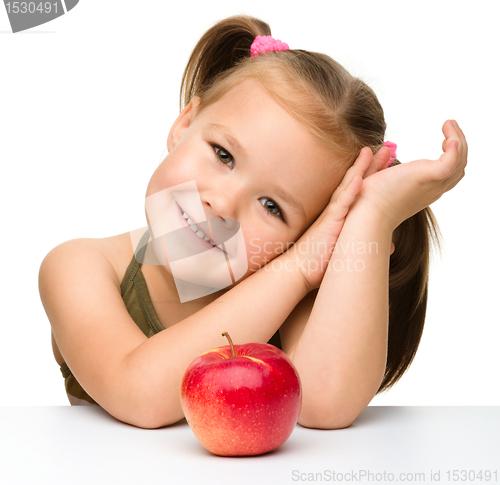 Image of Little girl with red apple