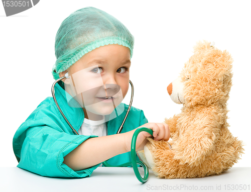 Image of Little girl is playing doctor with stethoscope