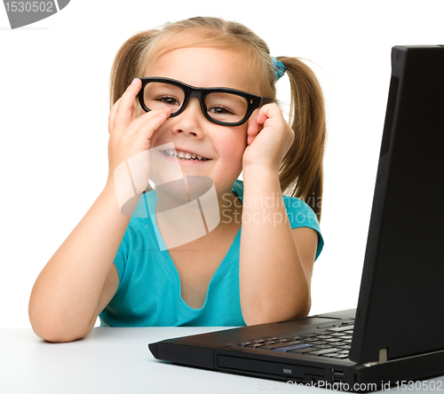 Image of Little girl with laptop
