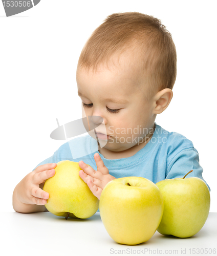 Image of Little boy with apple