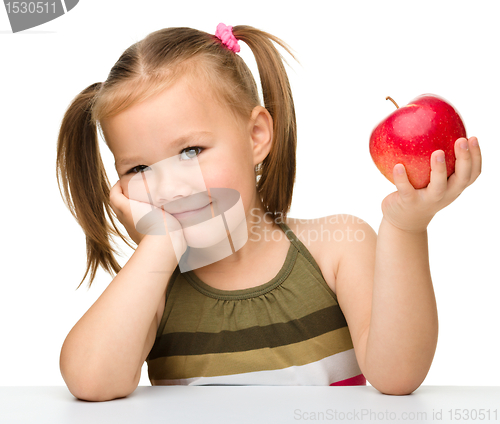Image of Little girl with red apple