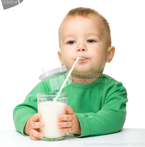 Image of Cute little boy is drinking milk