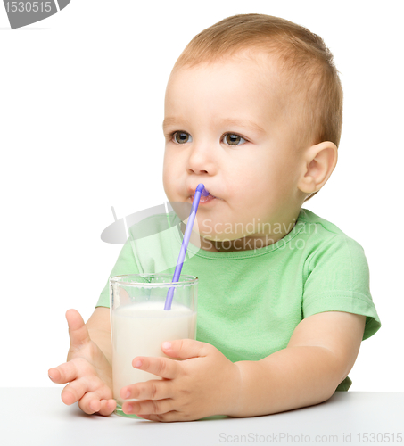 Image of Cute little boy is drinking milk