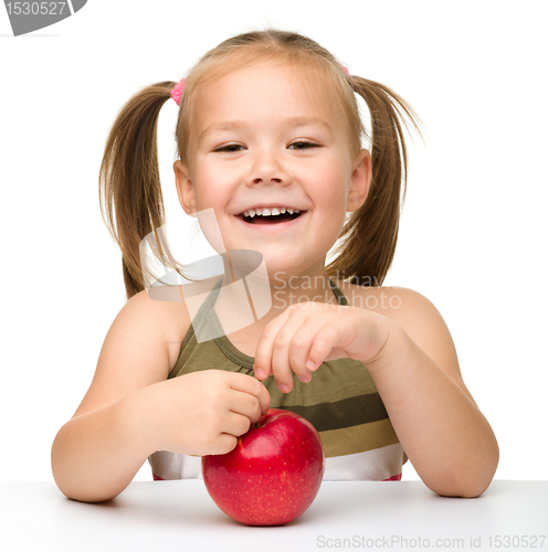 Image of Little girl with red apple
