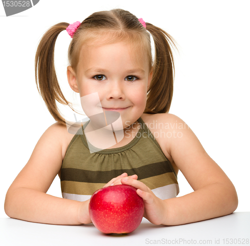 Image of Little girl with red apple