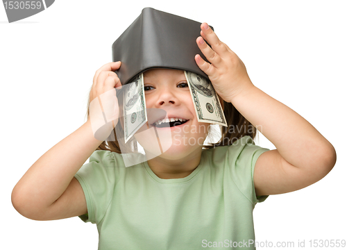 Image of Cute little girl with paper money - dollars