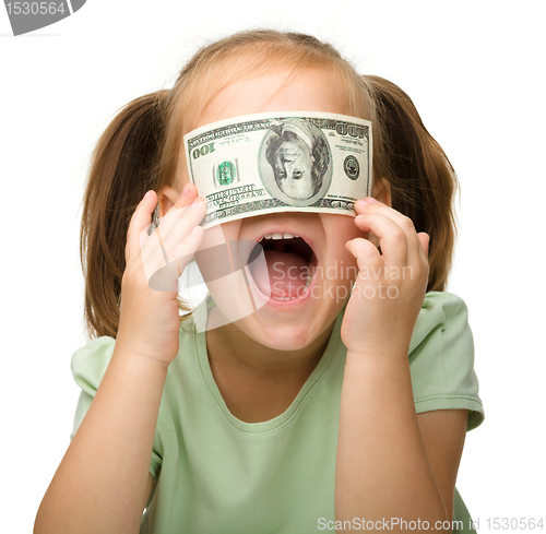 Image of Cute little girl with paper money - dollars