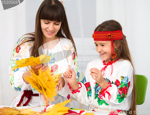 Image of Mother and child in Ukrainian national cloth