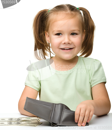 Image of Cute little girl with paper money - dollars