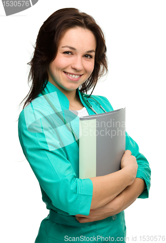 Image of Young attractive woman wearing a doctor uniform