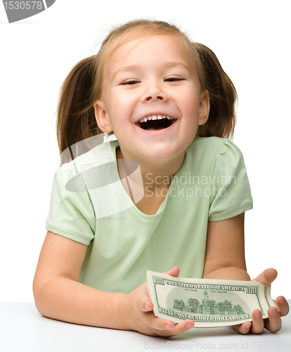 Image of Cute little girl with paper money - dollars