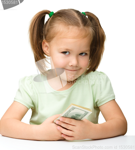 Image of Cute little girl with paper money - dollars