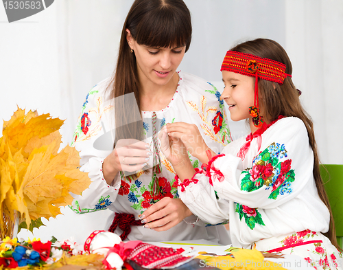 Image of Mother and child in Ukrainian national cloth