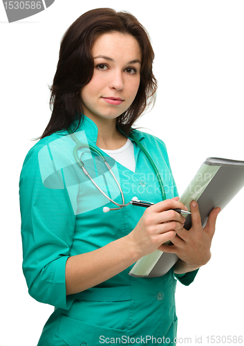 Image of Young attractive woman wearing a doctor uniform