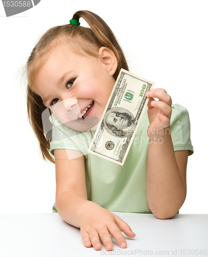 Image of Cute little girl with paper money - dollars