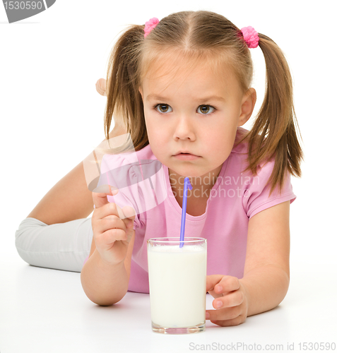 Image of Little girl drinks milk