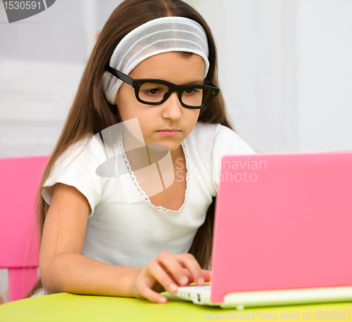 Image of Little girl with laptop