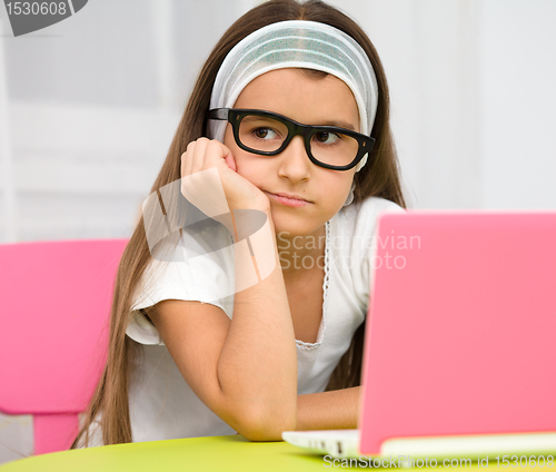 Image of Little girl with laptop
