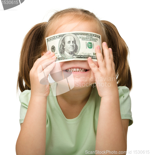Image of Cute little girl with paper money - dollars