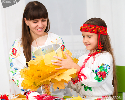 Image of Mother and child in Ukrainian national cloth