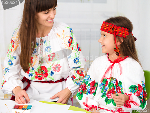 Image of Mother and child in Ukrainian national cloth