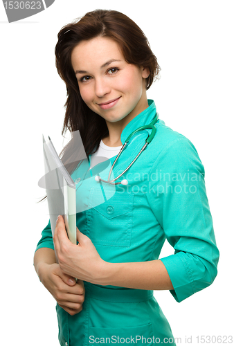Image of Young attractive woman wearing a doctor uniform