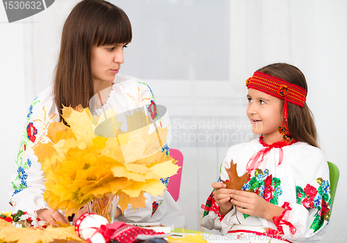 Image of Mother and child in Ukrainian national cloth