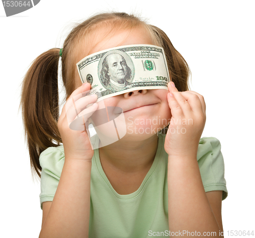 Image of Cute little girl with paper money - dollars