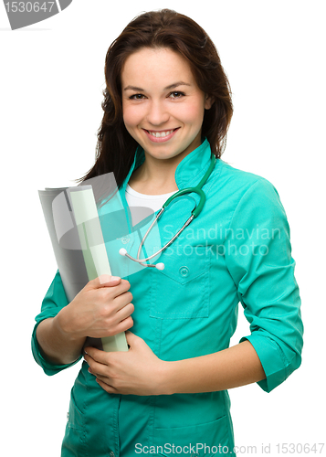 Image of Young attractive woman wearing a doctor uniform