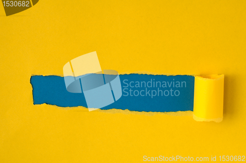 Image of Red torn paper with blue space for text 
