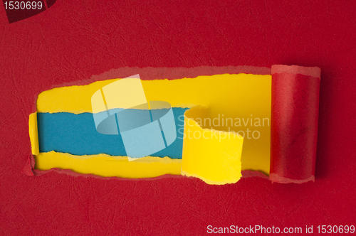 Image of Red torn paper with blue space for text