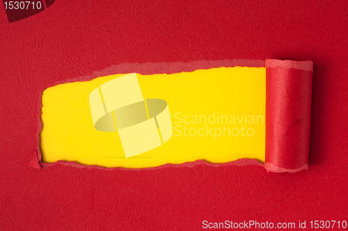 Image of Red torn paper with yellow space for text 