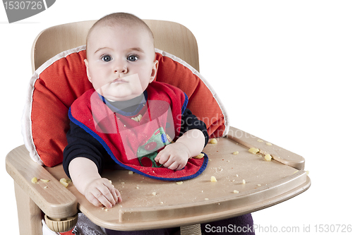 Image of toddler eating potatoes