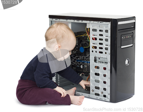 Image of young child with open computer