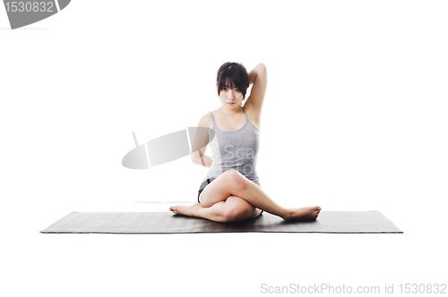 Image of Chinese woman doing yoga.