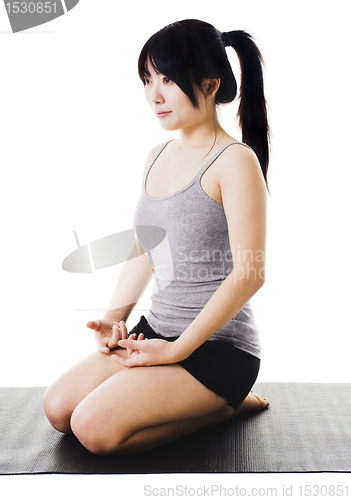 Image of Chinese woman doing yoga.