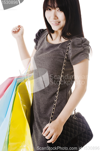 Image of Chinese woman holding shopping bags.