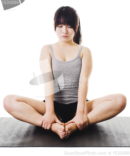 Image of Chinese woman doing yoga.