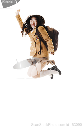 Image of Chinese school girl jumping in the air.