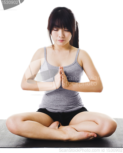 Image of Chinese woman doing yoga.