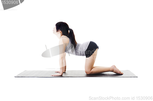 Image of Chinese woman doing yoga.