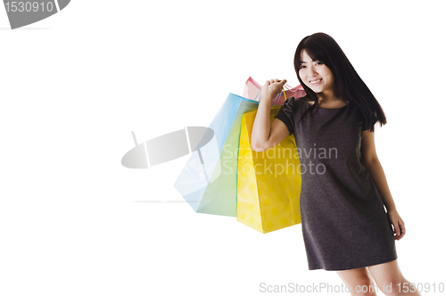 Image of Chinese woman holding shopping bags.