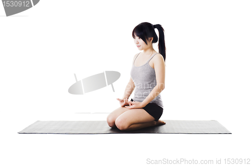 Image of Chinese woman doing yoga.