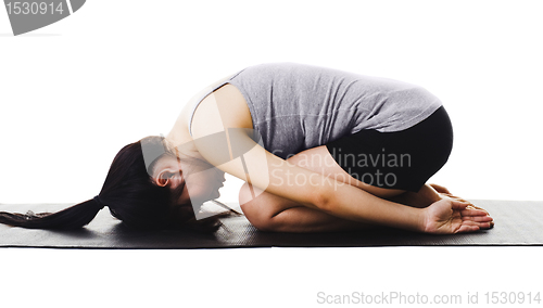 Image of Chinese woman doing yoga.