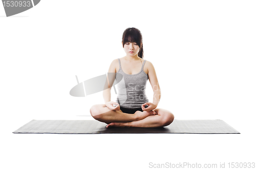 Image of Chinese woman doing yoga.