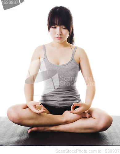 Image of Chinese woman doing yoga.